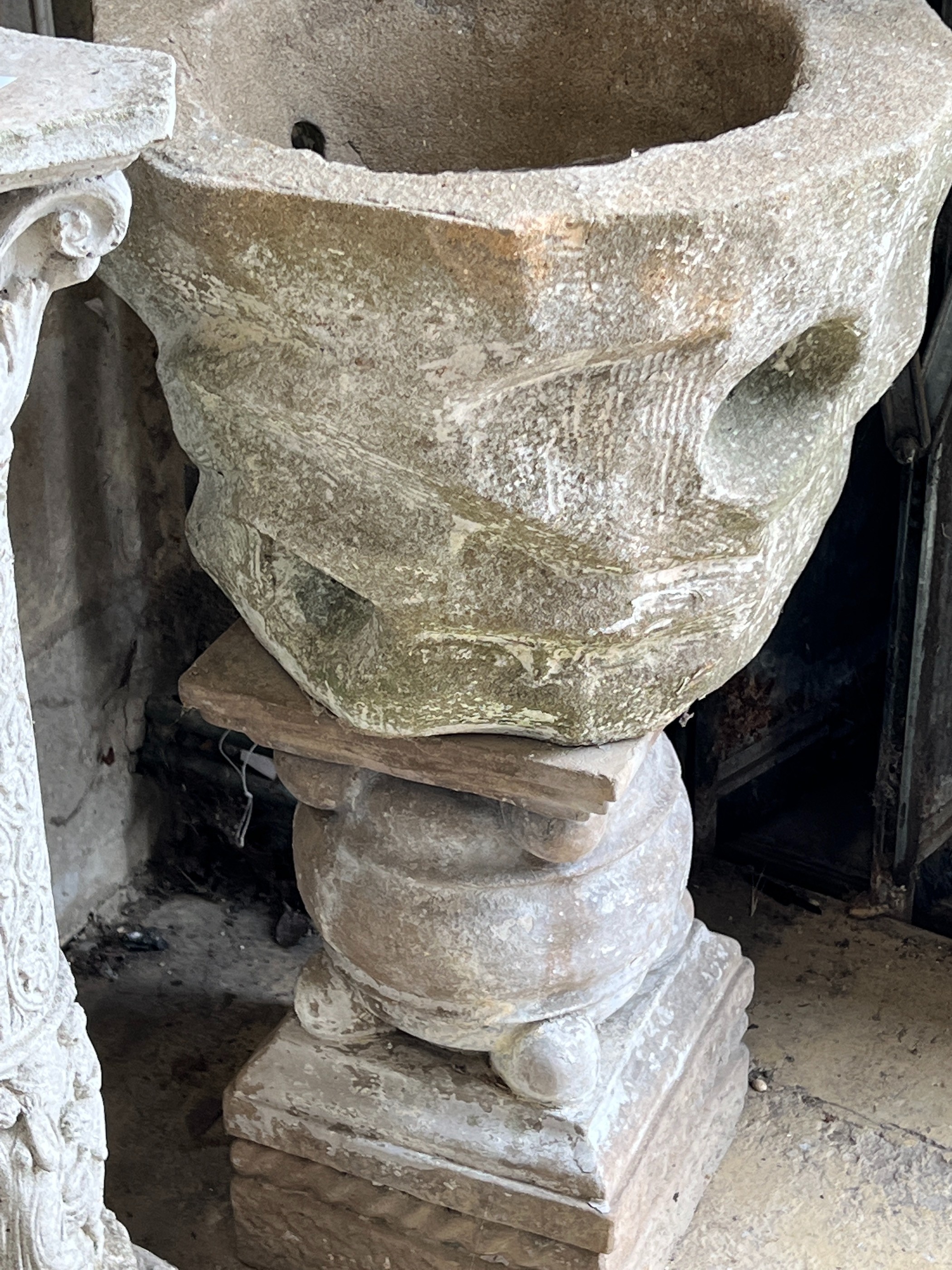 A garden planter on associated plinth, a garden column and two circular garden planters